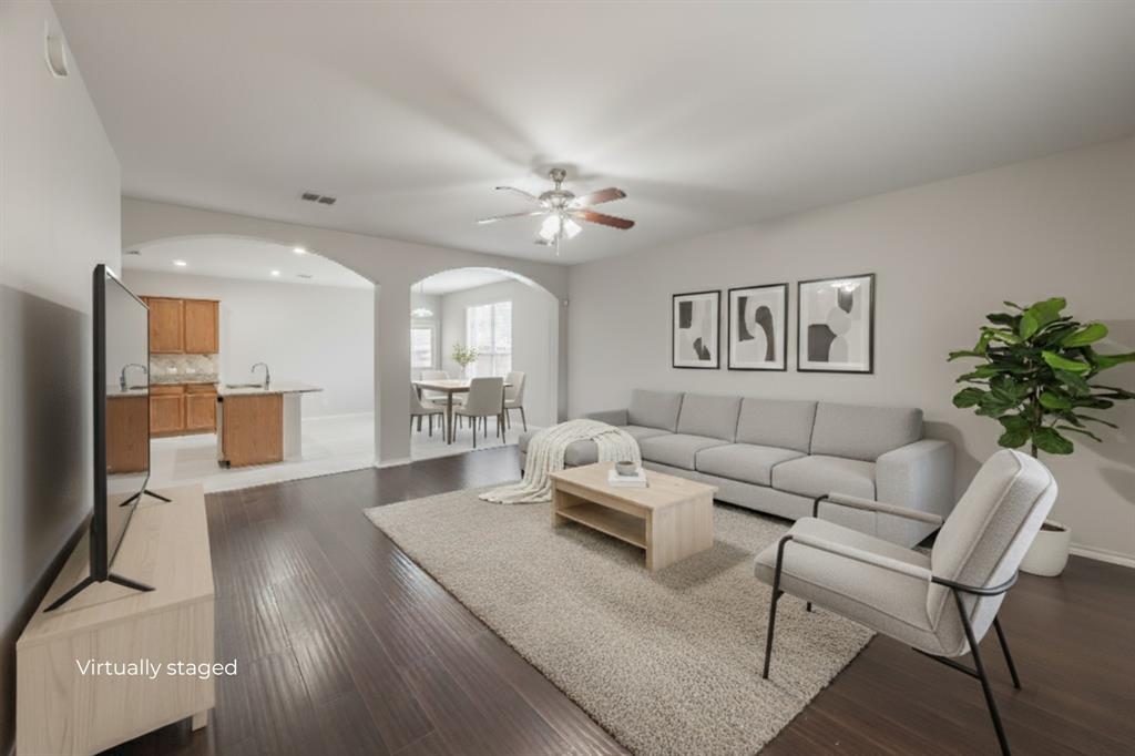 5446 Prairie Lane Grand Prairie, TX 75052 - Photo 3 of 39 a living room with furniture and a chandelier