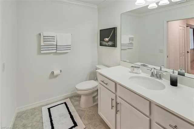 a bedroom with 2 bed and a large window