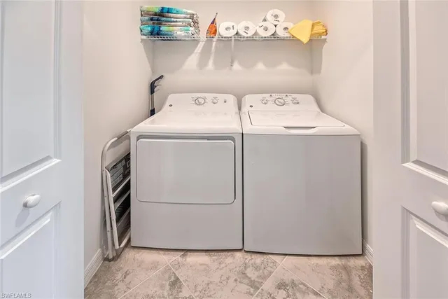 a view of a balcony with table and chairs