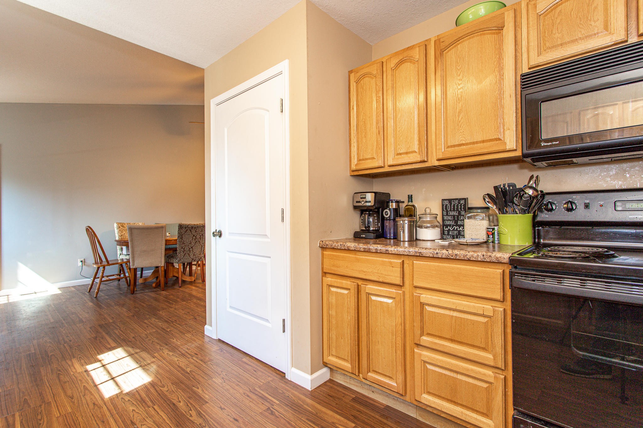 830 Collins Road Blaine, TN 37709 - Photo 11 of 34 a kitchen with stainless steel appliances granite countertop a stove a sink and a microwave