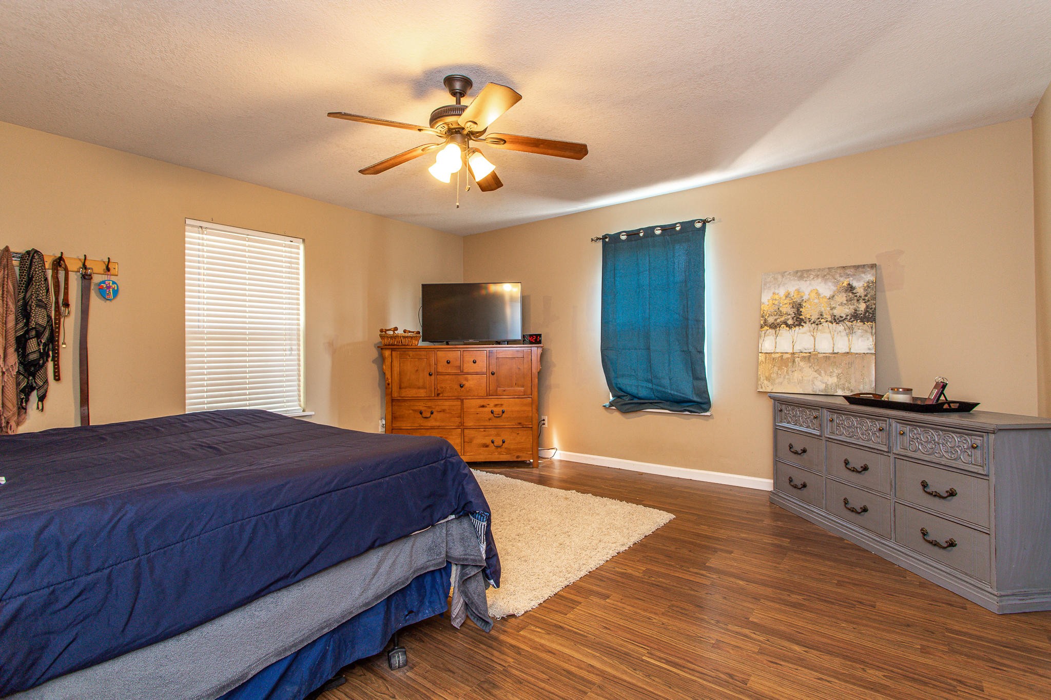 830 Collins Road Blaine, TN 37709 - Photo 14 of 34 a bedroom with a bed and wooden floor