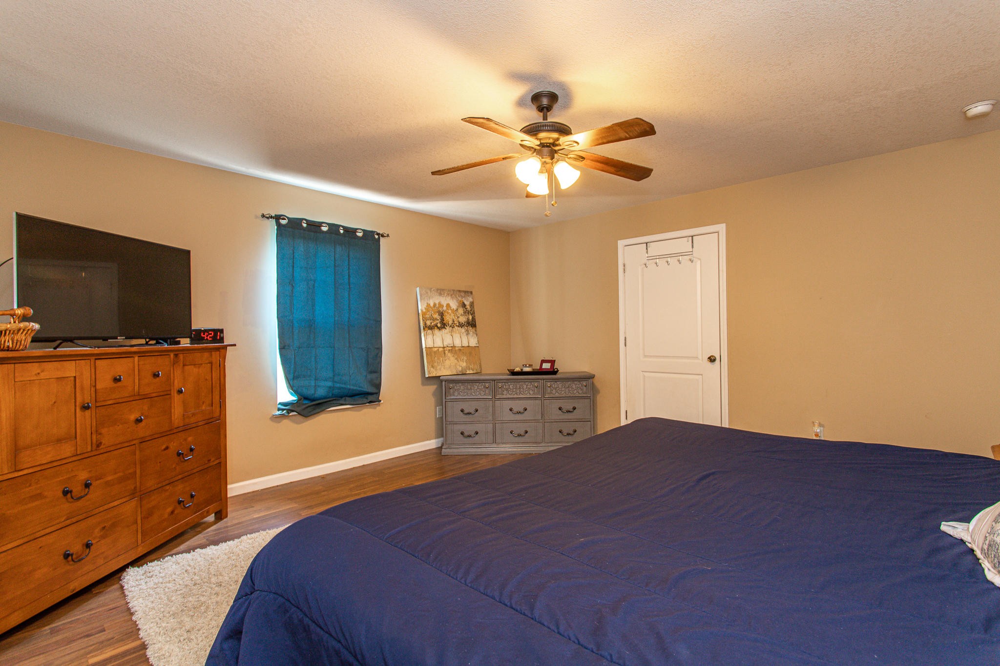 830 Collins Road Blaine, TN 37709 - Photo 16 of 34 a bedroom with a bed and a flat screen tv