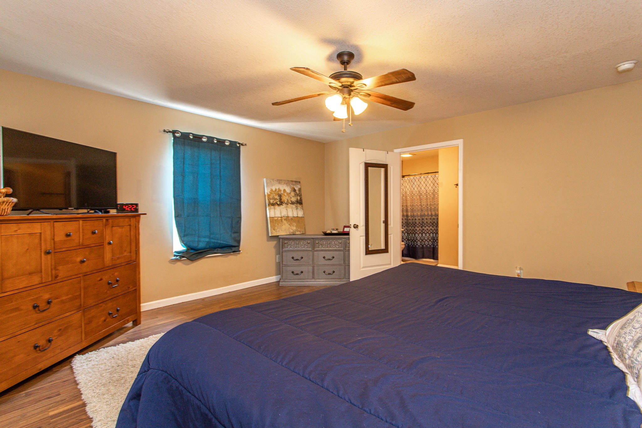 830 Collins Road Blaine, TN 37709 - Photo 17 of 34 a bedroom with a bed and a flat screen tv