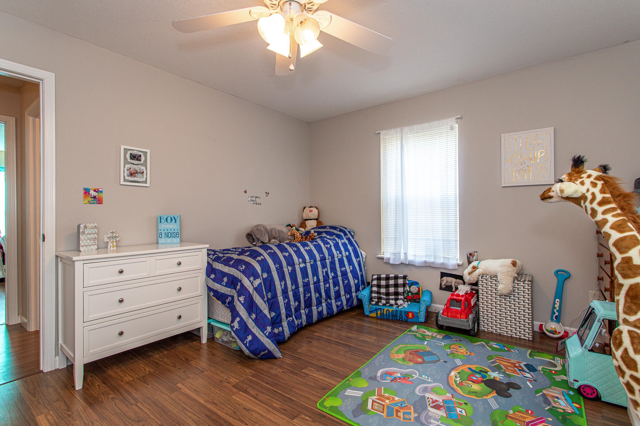830 Collins Road Blaine, TN 37709 - Photo 20 of 34 a bedroom with a bed and a wooden floor
