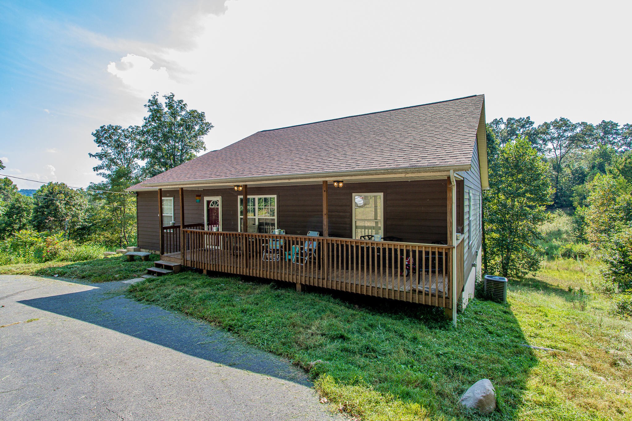 830 Collins Road Blaine, TN 37709 - Photo 2 of 34 a front view of a house with garden