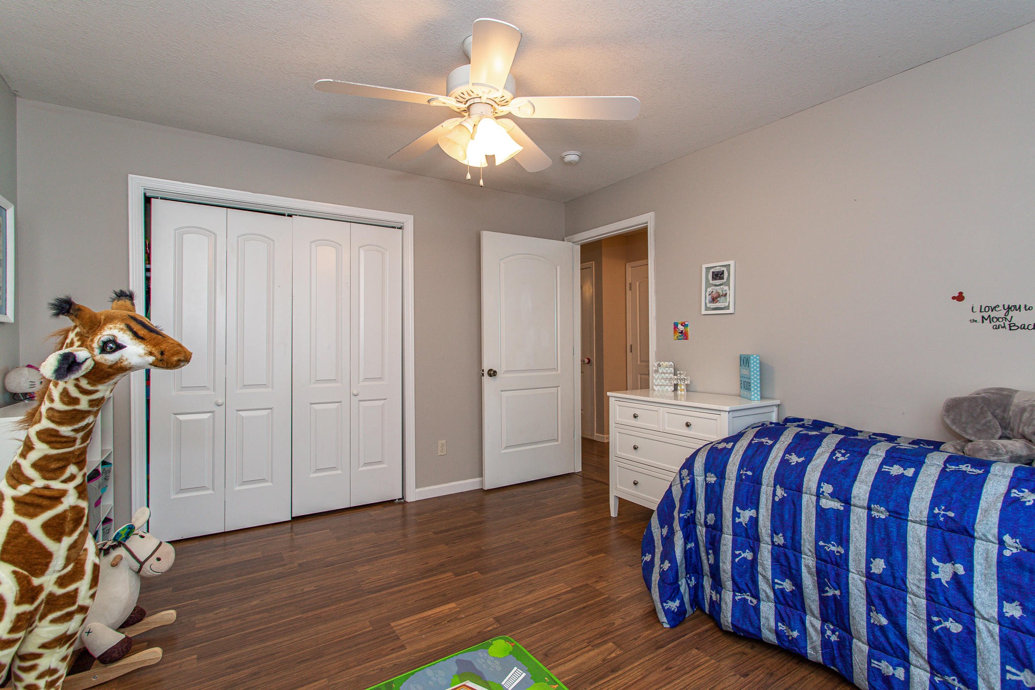 830 Collins Road Blaine, TN 37709 - Photo 21 of 34 a bedroom with a bed and wooden floor