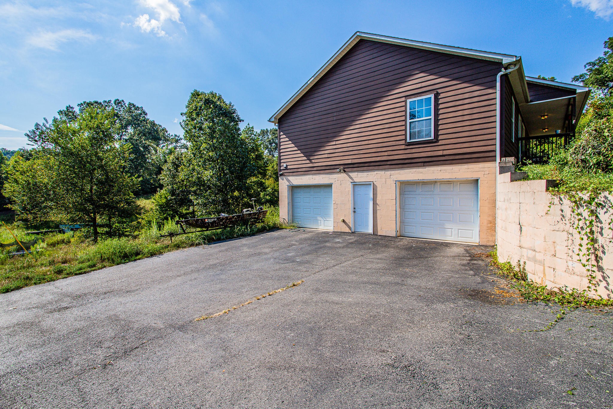 830 Collins Road Blaine, TN 37709 - Photo 34 of 34 a view of a house with a yard and garage