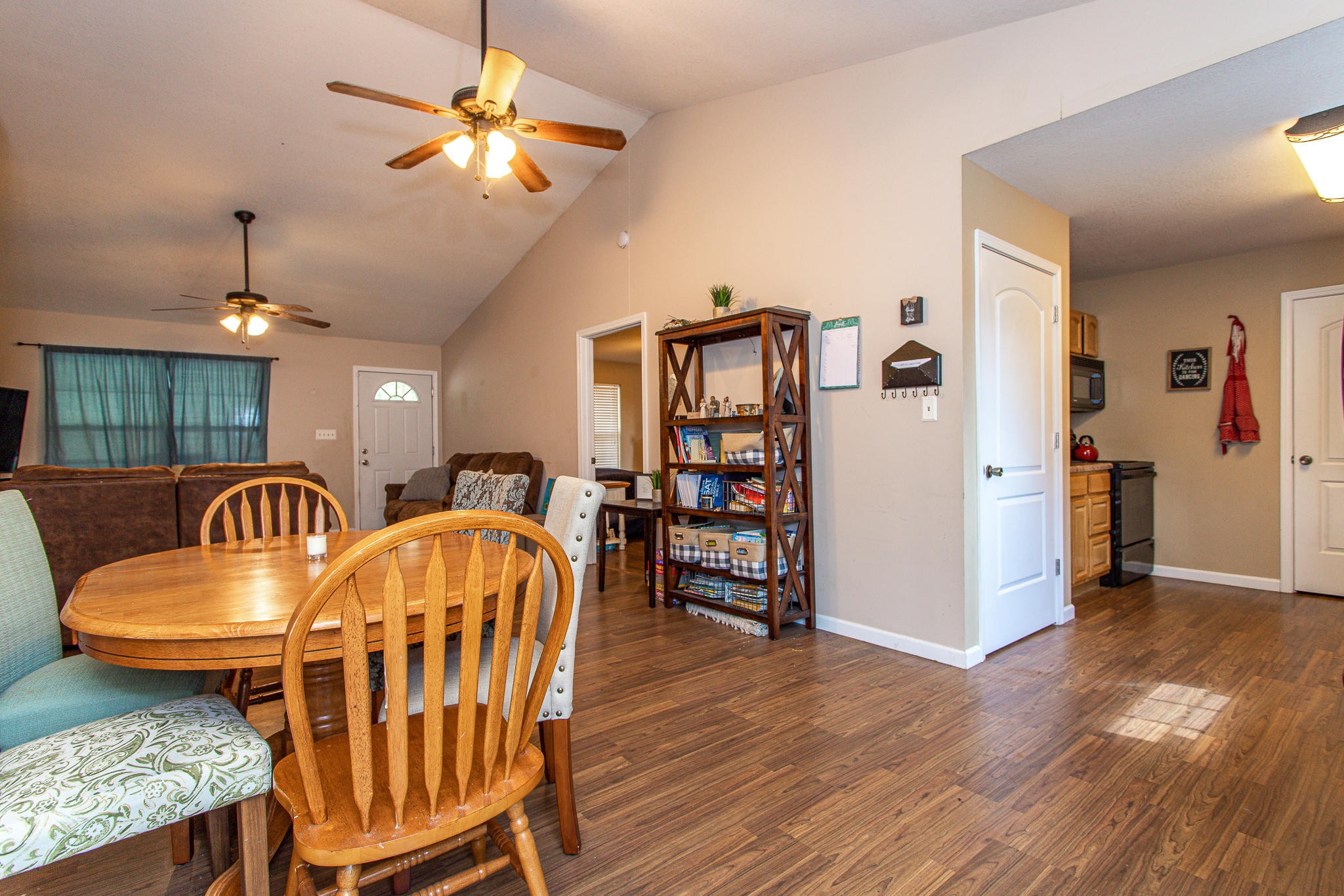 830 Collins Road Blaine, TN 37709 - Photo 8 of 34 a dining room with furniture a chandelier and wooden floor