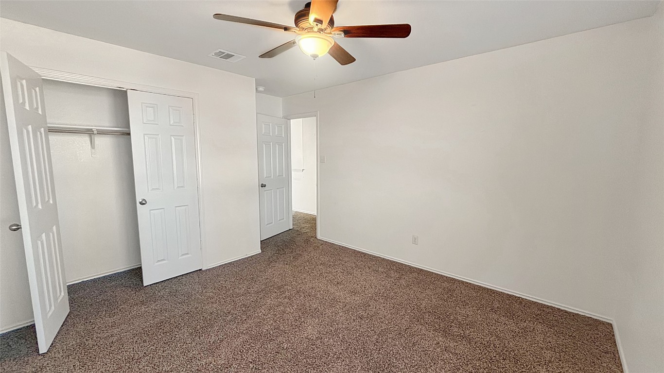133 Langtry Lane Jarrell, TX 76537 - Photo 13 of 27 Bedroom 2: all of these rooms are a really good size with nice closets. Ceiling fans necessary for this Texas weather.
