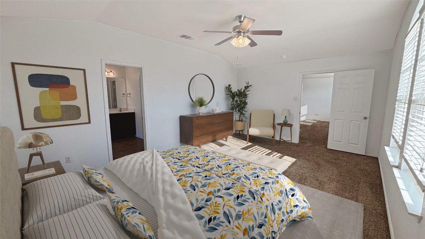 133 Langtry Lane Jarrell, TX 76537 - Photo 2 of 27 Bedroom featuring lofted ceiling, carpet flooring, a ceiling fan, and connected primary bathroom suite. Large room to accommodate your king bed, dressers, and even extra space for a reading area, or to fit your lifestyle needs. Virtually staged.