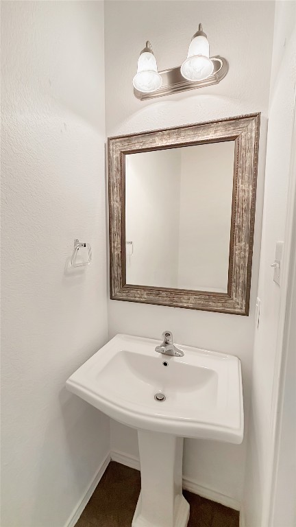 133 Langtry Lane Jarrell, TX 76537 - Photo 26 of 27 1/2 bathroom downstairs just off of the living room and close to the garage for your convenience.