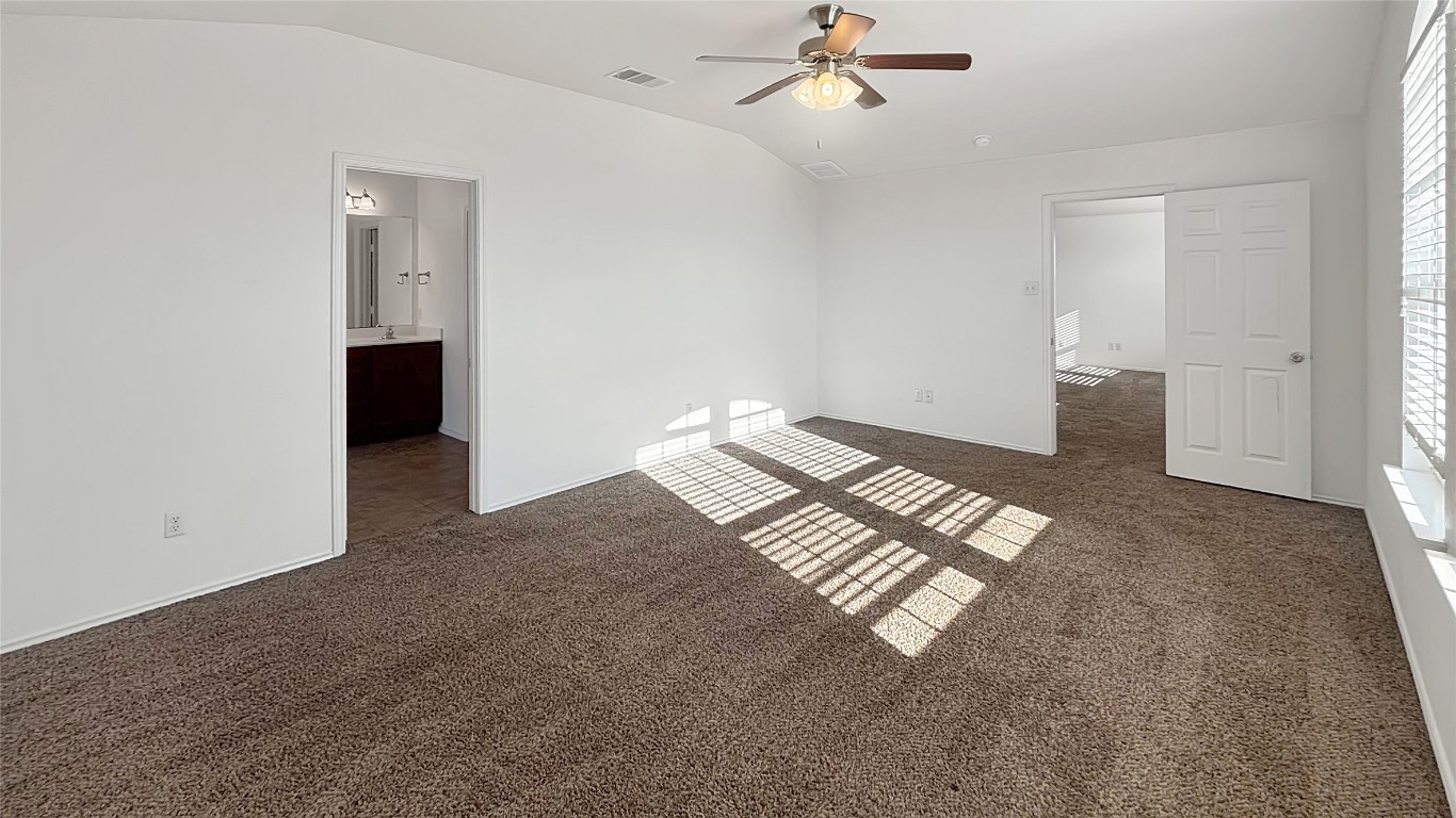 133 Langtry Lane Jarrell, TX 76537 - Photo 7 of 27 Primary bedroom view from door, check out the higher ceilings! Its on the opposite side of the other bedrooms and upper living room.