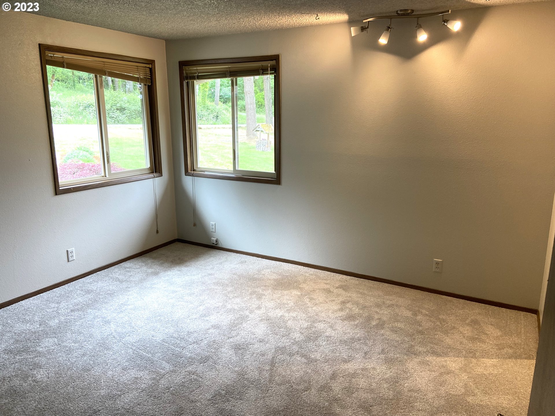 7905 South C Street Springfield, OR 97478 - Photo 13 of 28 a view of an empty room with a window