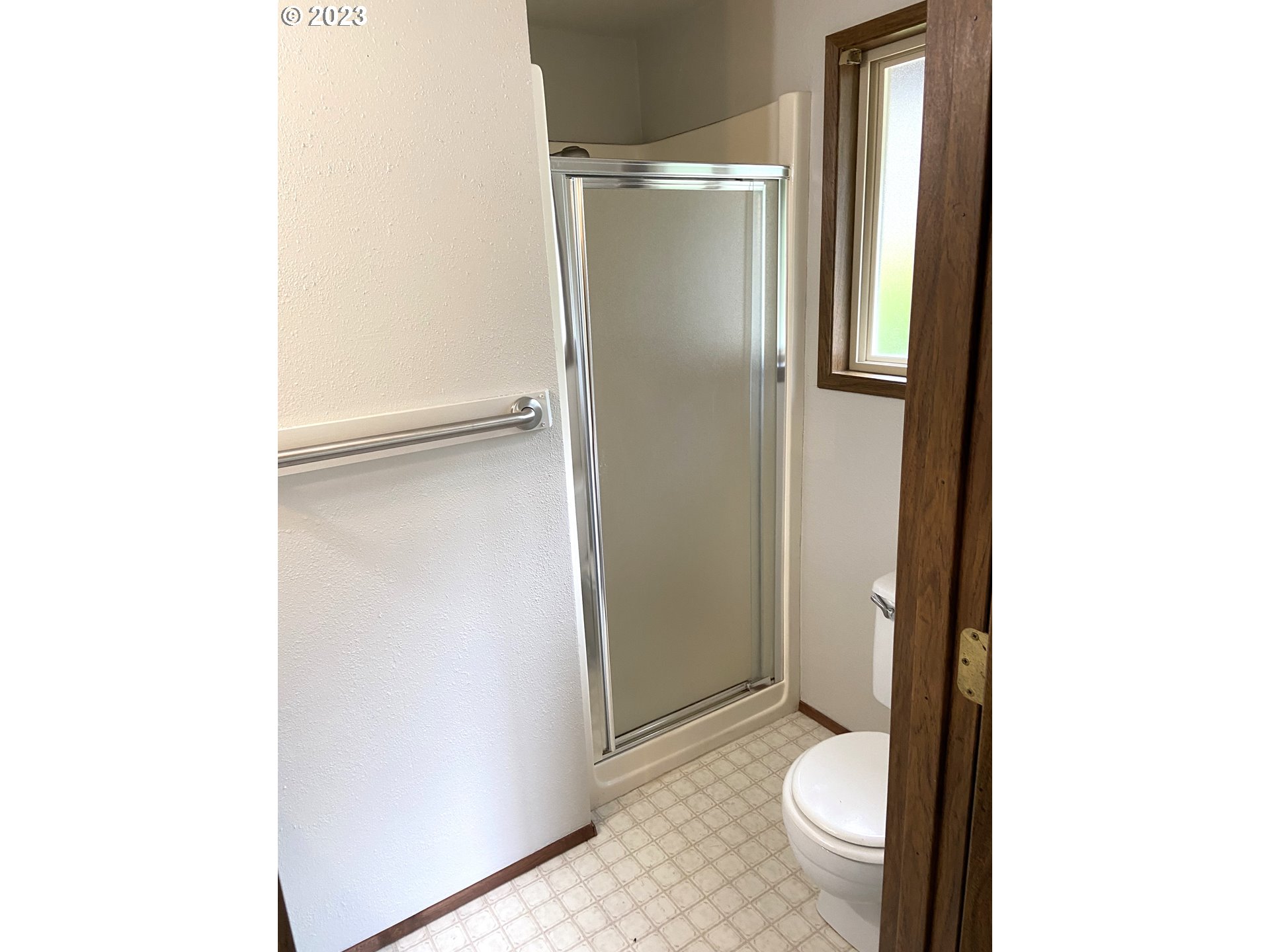 7905 South C Street Springfield, OR 97478 - Photo 15 of 28 a bathroom with a granite countertop toilet and a sink