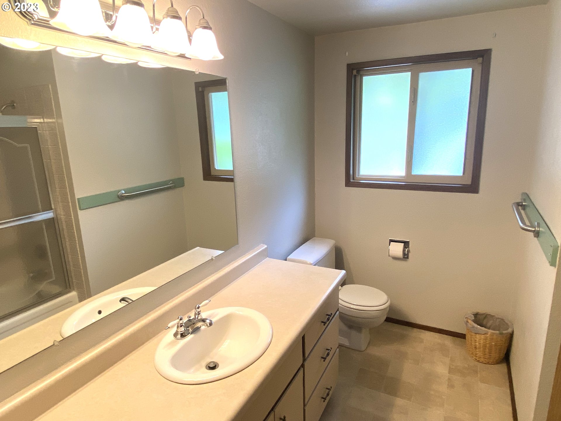 7905 South C Street Springfield, OR 97478 - Photo 18 of 28 a bathroom with a sink a toilet and mirror