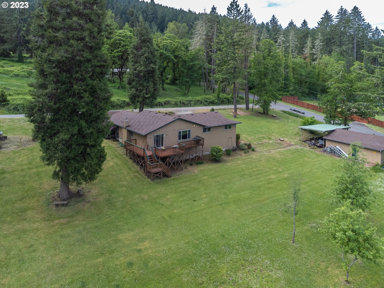 7905 South C Street Springfield, OR 97478 - Photo 21 of 28 a aerial view of a house with pool and a yard
