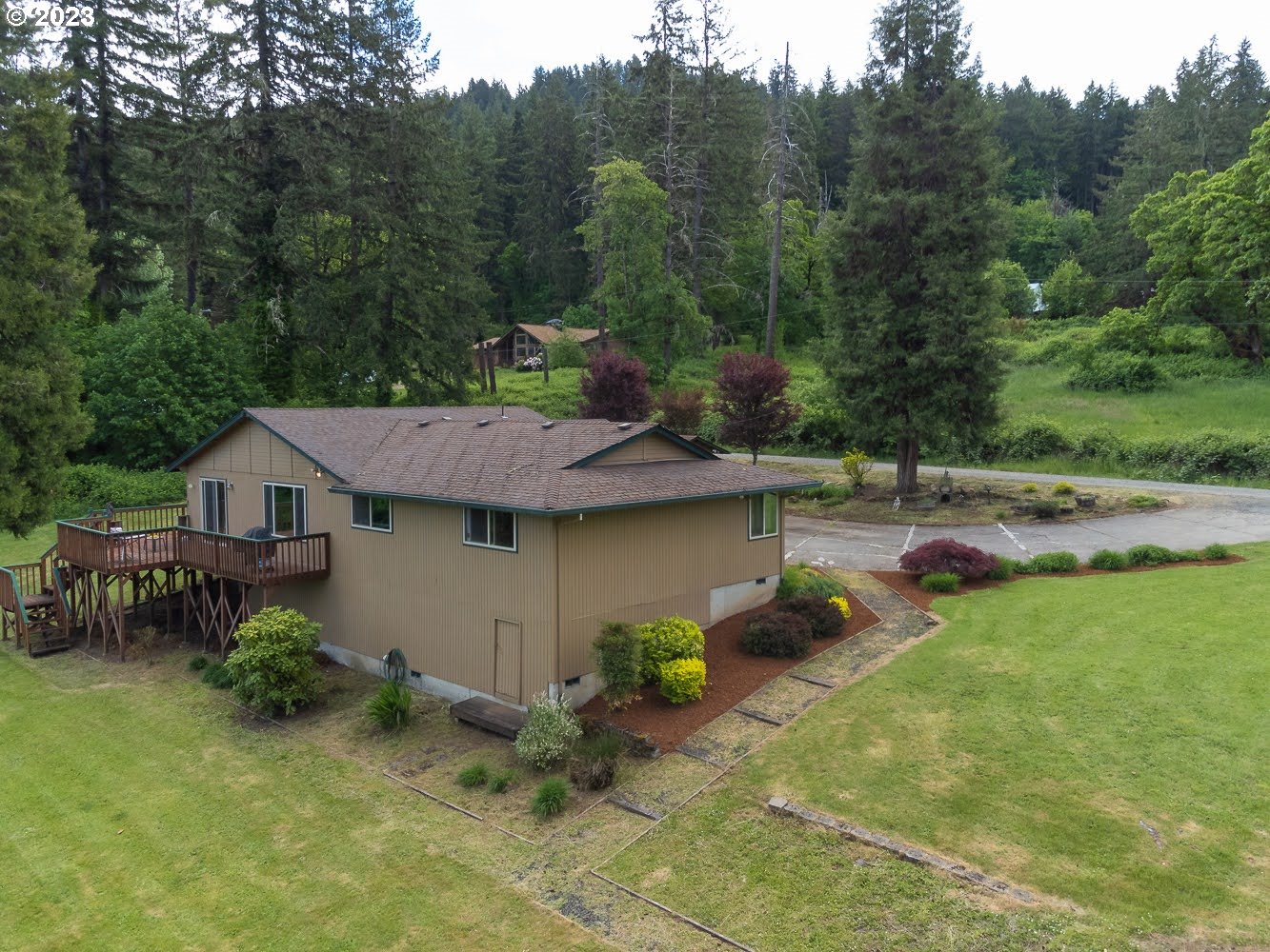7905 South C Street Springfield, OR 97478 - Photo 22 of 28 a backyard of a house with table and chairs