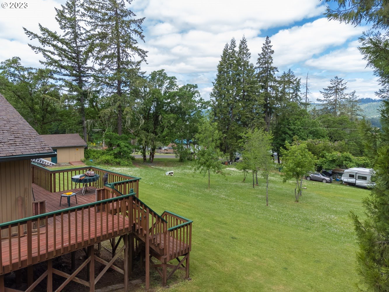 7905 South C Street Springfield, OR 97478 - Photo 25 of 28 a view of a deck with a table and chairs