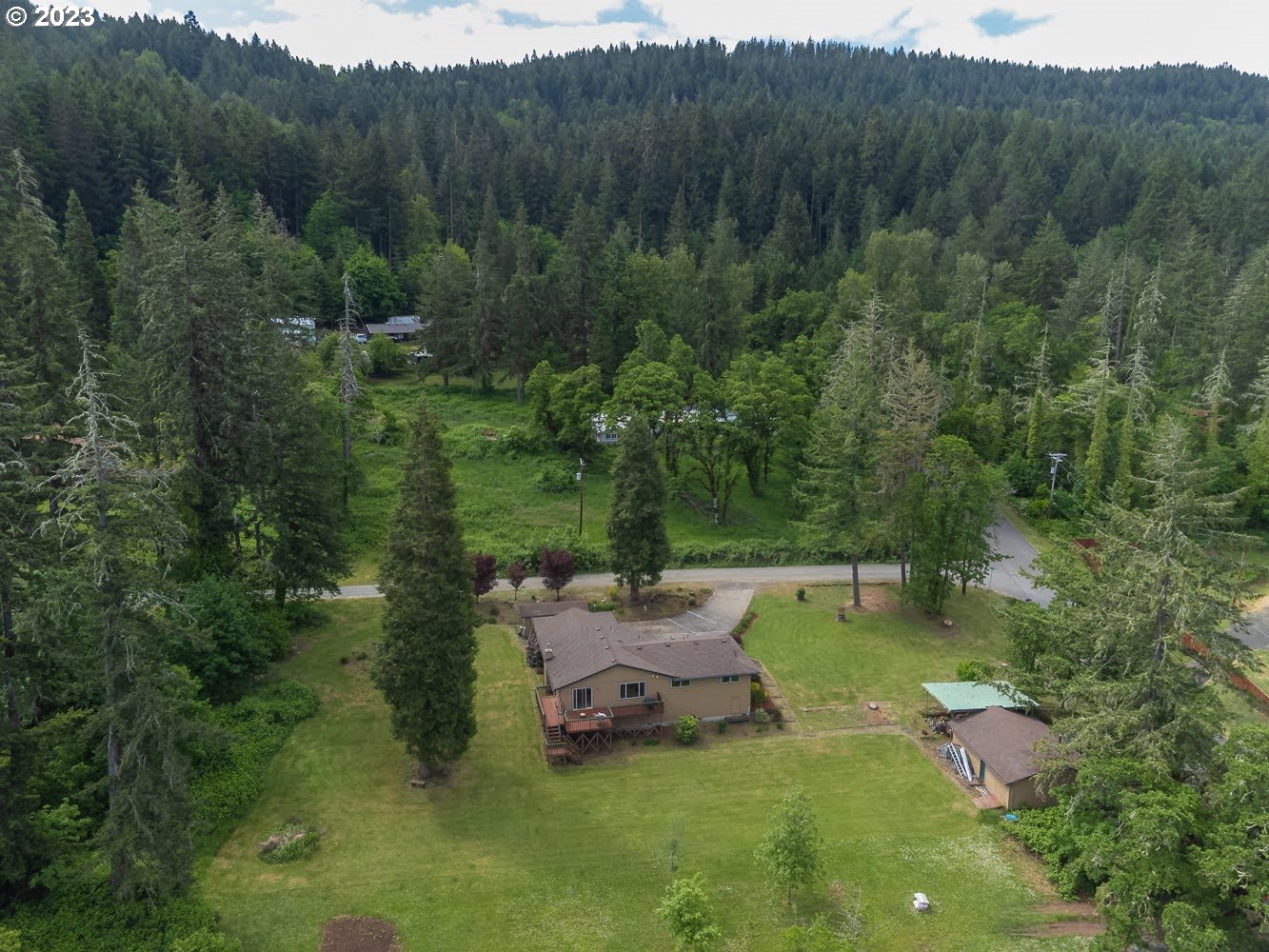 7905 South C Street Springfield, OR 97478 - Photo 27 of 28 a view of a swimming pool with a yard