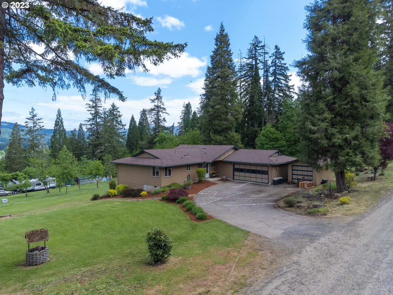 7905 South C Street Springfield, OR 97478 - Photo 3 of 28 a backyard of a house with table and chairs