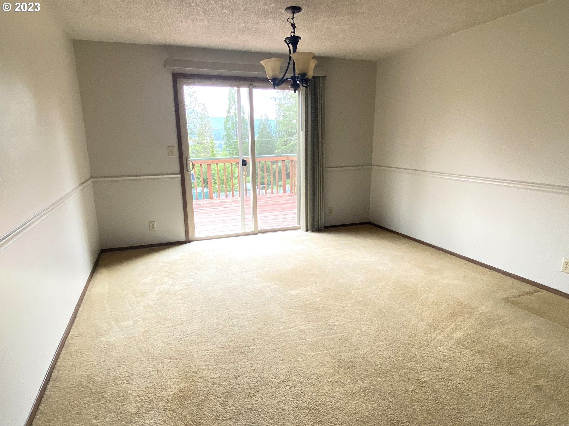 7905 South C Street Springfield, OR 97478 - Photo 6 of 28 a view of an empty room with a window