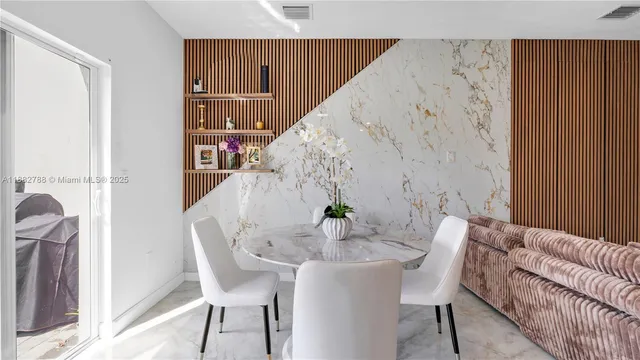 a dining room with furniture and wooden floor