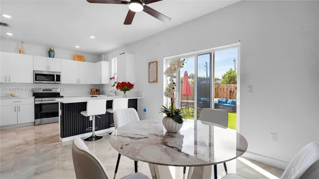 a dining room with furniture and window