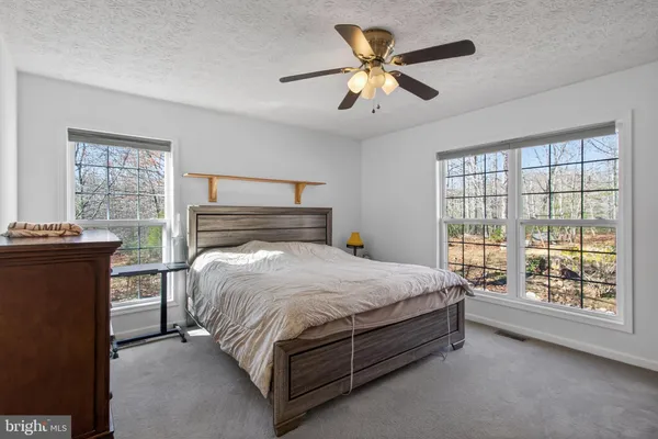a bed room with a bed and a chandelier