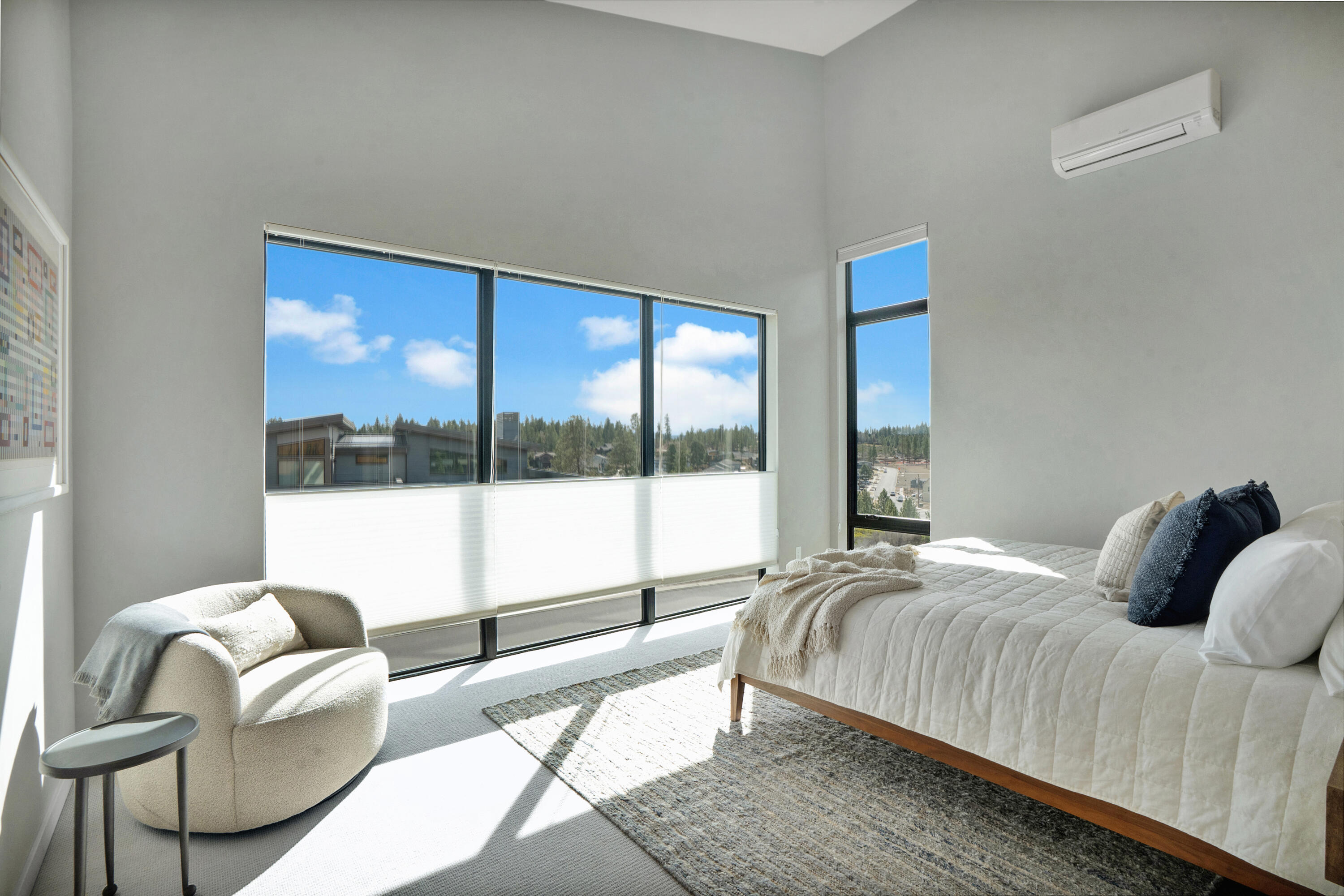 61250 Meeks Trail Bend, OR 97702 - Photo 23 of 43 a bedroom with a bed and a large window