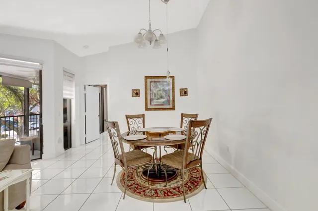 a kitchen with a refrigerator sink and cabinets