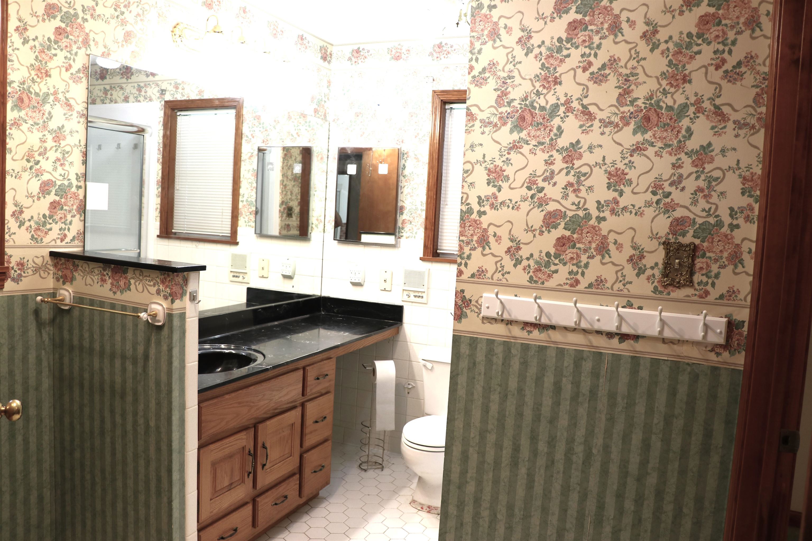 937 Kelleys Chapel Road Burlison, TN 38015 - Photo 15 of 40 Bathroom featuring a wood-finish vanity with a built-in black countertop and circular sink