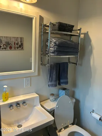 a bathroom with a toilet and a sink