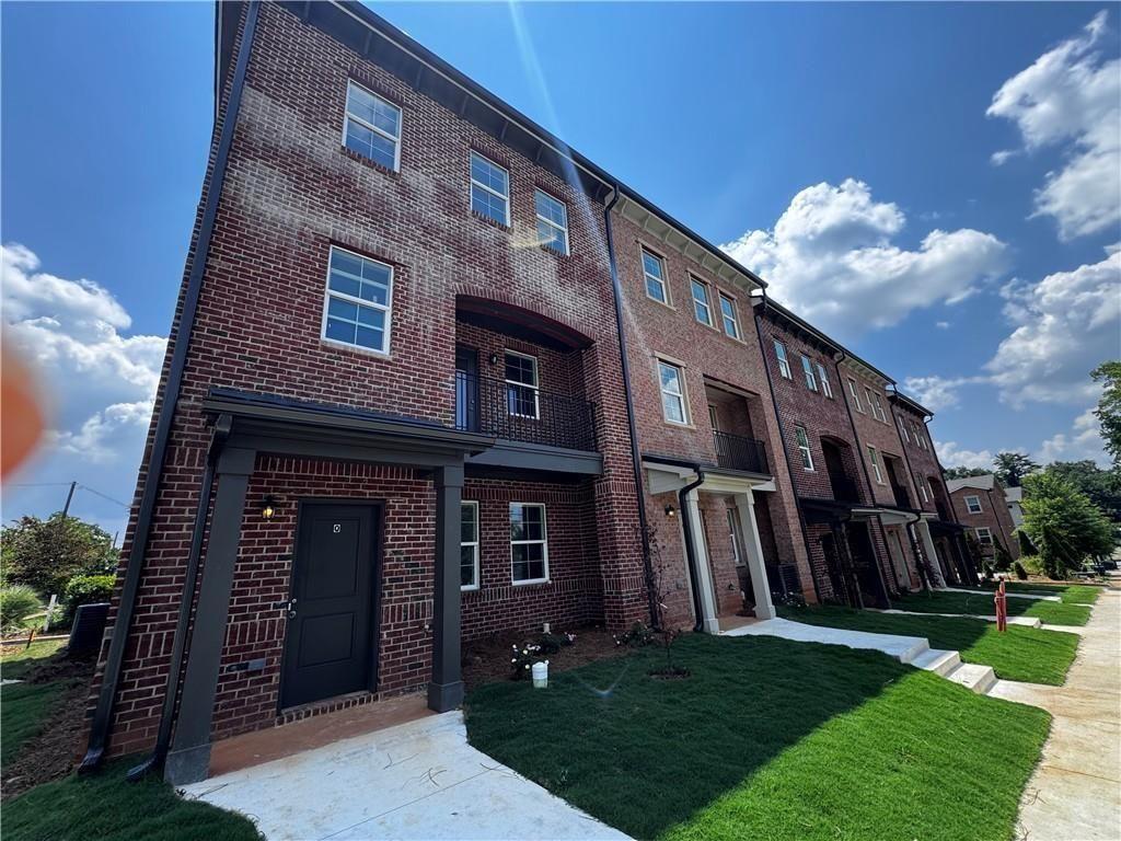 1777 Temple Avenue, Unit P Atlanta, GA 30337 - Photo 2 of 22 a view of a house with a yard