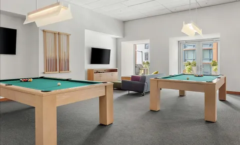 a room with furniture and a flat screen tv