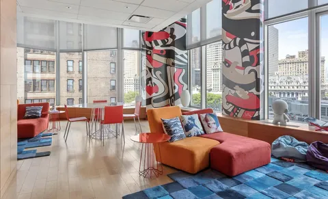 a bedroom with furniture and a window