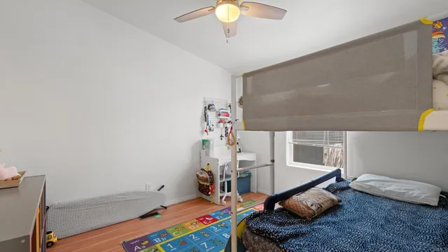 a bed room with a bed and a chandelier