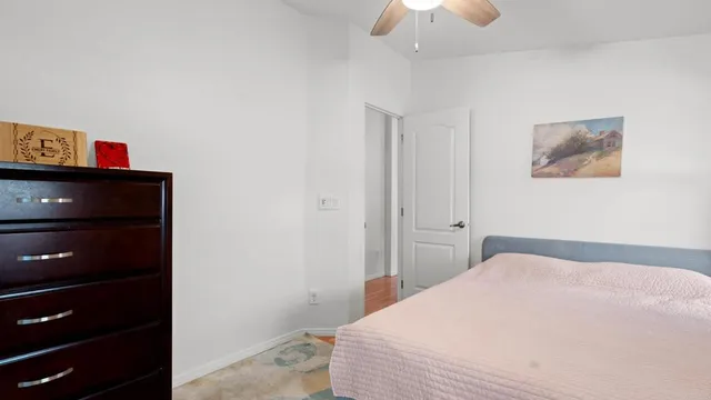 a bedroom with a bed and a cabinets