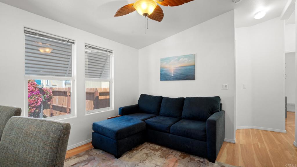 7495 Oakland Road, Unit 23 La Mesa, CA 91942 - Photo 20 of 24 a living room with furniture and a large window