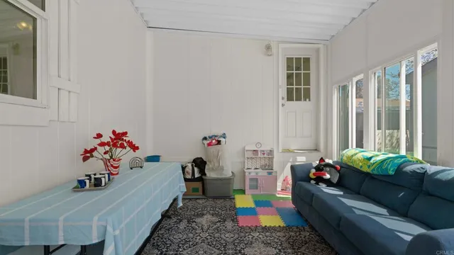 a room with toys and flowers