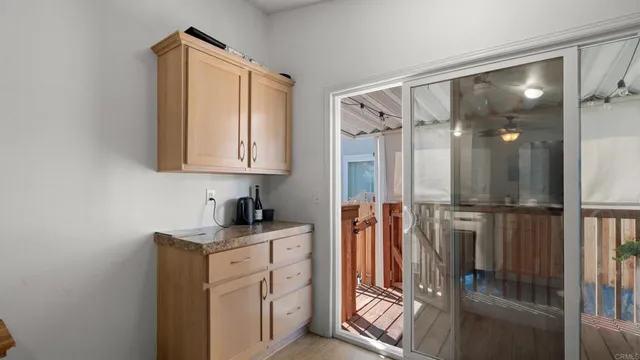 a view of a kitchen with electric appliances