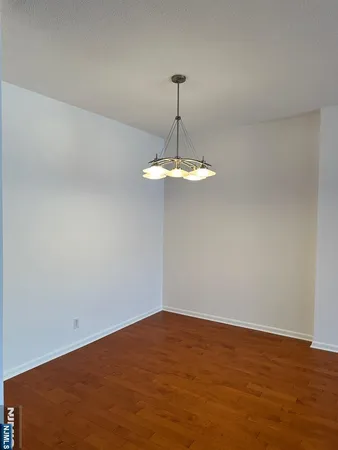 a view of a chandelier fan in a room