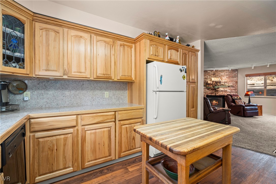 321 Ski Way, Unit 24 Incline Village, NV 89451 - Photo 8 of 31 a kitchen with refrigerator cabinets and wooden floor