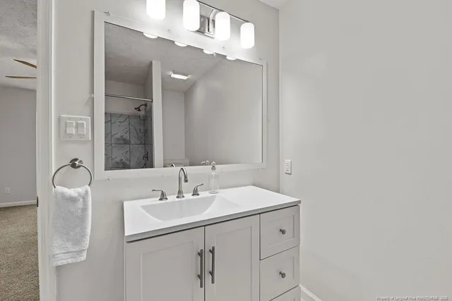 a bathroom with a sink double vanity and a mirror