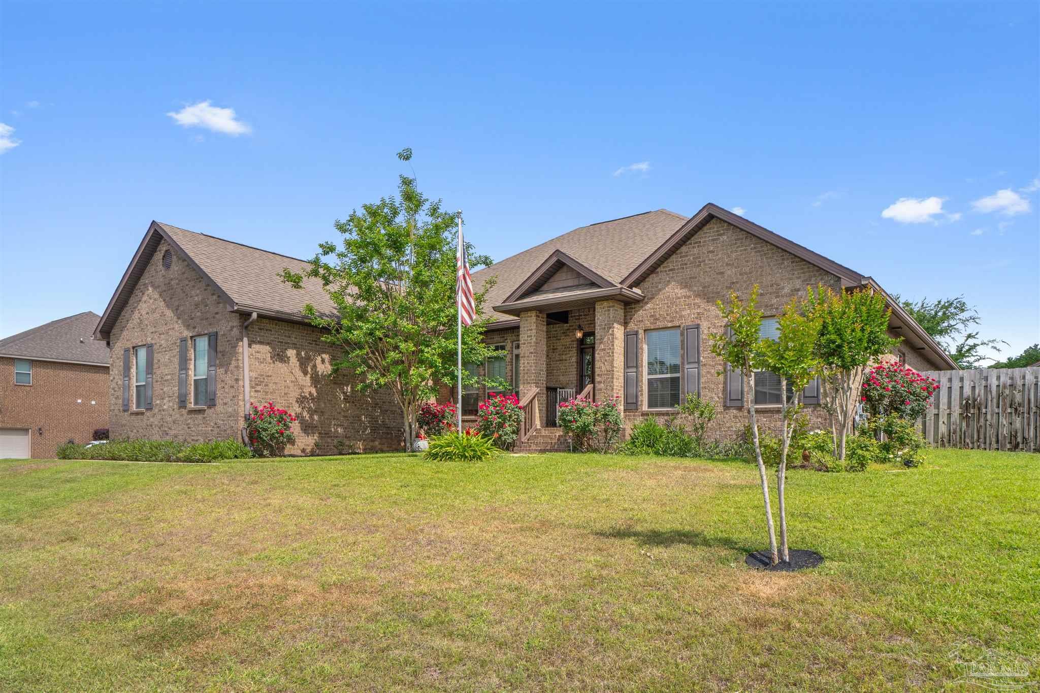 2698 Tulip Hill Road Pace, FL 32571 - Photo 7 of 65 a front view of a house with a yard