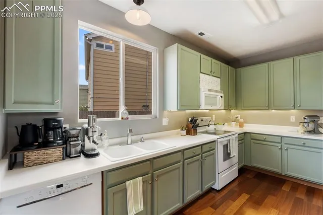 a bathroom with a sink a mirror and a toilet