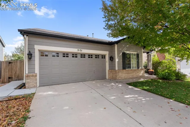a front view of a house with a garage