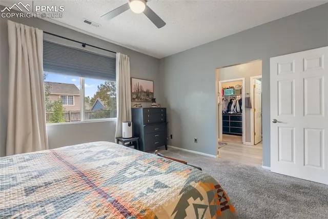 a bathroom with a double vanity sink toilet and shower