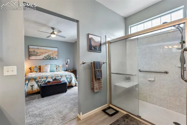 a bathroom with a shower and a sink