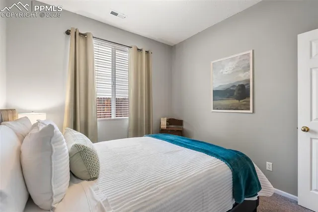 a living room with couch and a large window