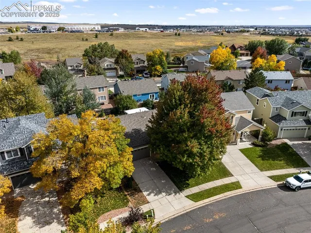 an aerial view of a house with a ocean view